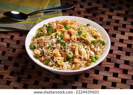 Vegetable Chicken or Mixed Fried Rice served in dish isolated on table side view of middle east food Royalty-Free Stock Photo #2224439601