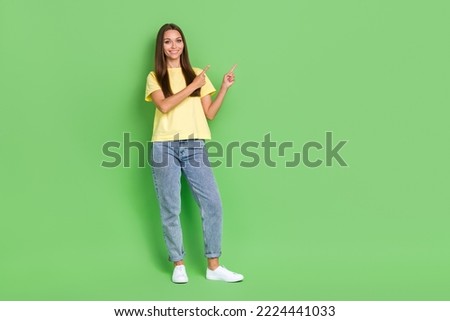 Full length photo of cute sweet lady two arm direct empty space offer visit cool boutique isolated on green color background