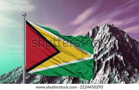 Guyana national flag cloth fabric waving on beautiful Mountain Background.