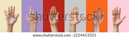 Collection of human hands with rubber bands on color background