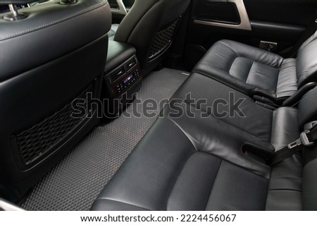 Leather car seat. View of the car interior. Back row of the car.