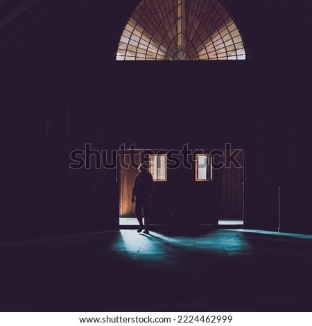 silhouette of person in the doors
