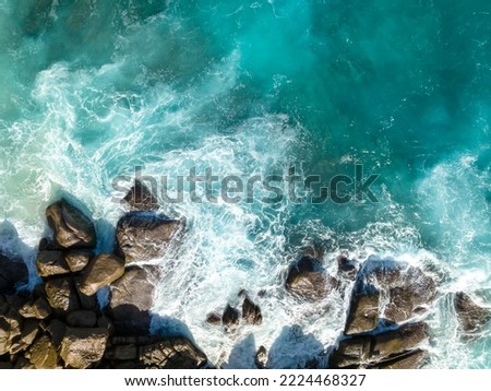 Aerial view Top down seashore. Waves crashing on rock cliff. Beautiful dark sea surface in sunny day summer background Amazing seascape top view seacoast at Intendance Beach, Mahe Seychelles Royalty-Free Stock Photo #2224468327