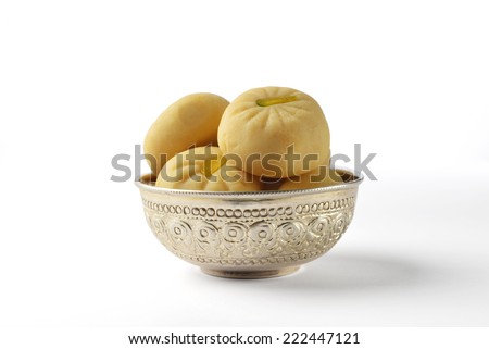 Pedha - a traditional indian sweet in a silver bowl. isolated image.
