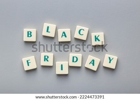 Black friday text on the gray background. Top view.