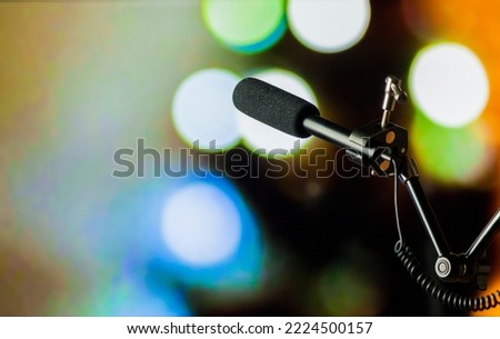 Podcast microphone on colored background with copy space. mic in studio. Microphone concept. Podcast concept.