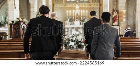 Funeral, church and group carry coffin in service, death or sermon for burial with support. Friends, family or pallbearers with casket for respect, help or sorrow in mourning, worship or god religion Royalty-Free Stock Photo #2224565169