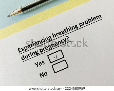 One person is answering question about pregnancy. During pregnancy, she experiences breathing problem.