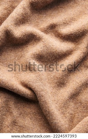 Seamless texture of handmade knitting of natural yarn. Knitted background. 