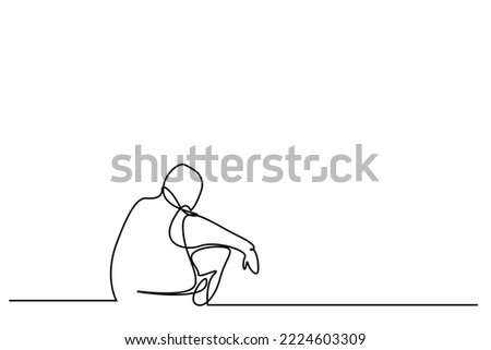 unhappy homeless thoughtful person sitting outside on the floor Royalty-Free Stock Photo #2224603309