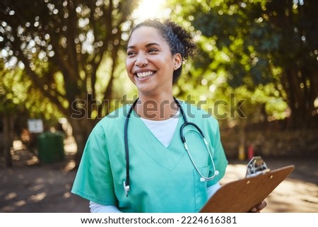 Woman, nurse and smile with clipboard in the park for healthcare, medical or consultation and assistance. Happy female doctor or veterinary in nursing check, inspection or prescription advice outside Royalty-Free Stock Photo #2224616381