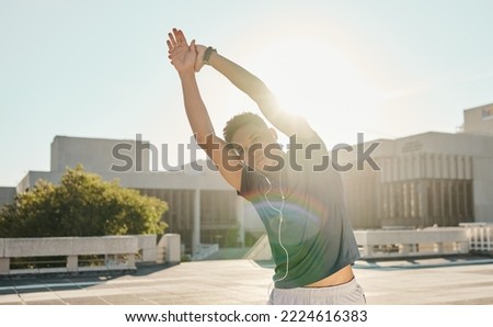 Fitness, stretching and music with sports man in a city for running, health and morning cardio, zen and mindset. Sports man, arm stretch and podcast by black man prepare body for workout at sunrise