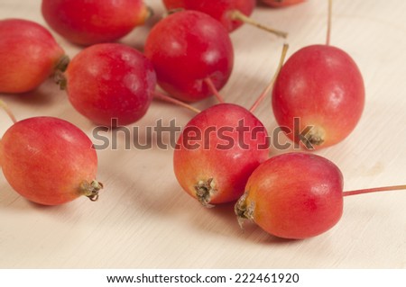 Crab (Paradise) apples on a wood board, autumn picture