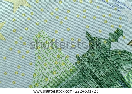 Fine microprint on hundred euro banknote protection against counterfeit.