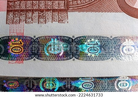 Hologram tamper-proof currency seal authenticity watermark of ten euro banknote, forgery protection macro