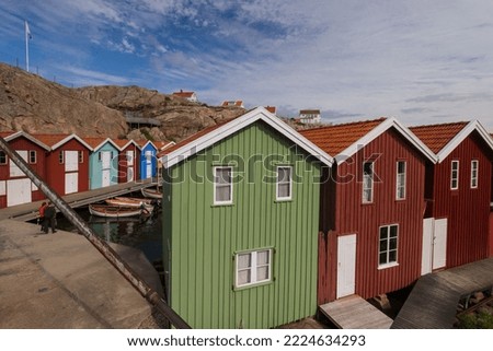 Colorful wooden fishing huts at the picturesque harbour of Smögen.