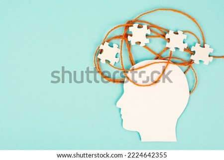 ADHD, attention deficit hyperactivity disorder, mental health, head with puzzle pieces Royalty-Free Stock Photo #2224642355