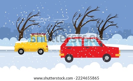 Two cars are driving down the road in a snowstorm Royalty-Free Stock Photo #2224655865