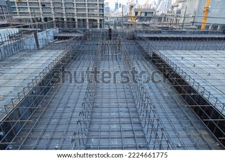 Rusted Steel Reinforcement for Post-Tension Concrete Floors is a floor system which draws prestressed wire. Royalty-Free Stock Photo #2224661775