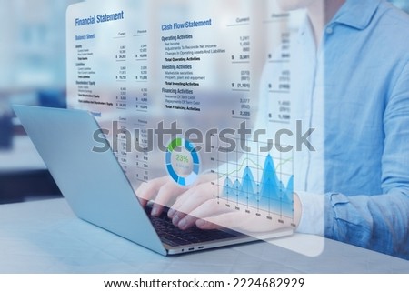 Accountant analysing financial statement with graph on computer. Auditing balance sheet, sales and income report, business operations data, corporate accounts. Finance and consulting. Royalty-Free Stock Photo #2224682929