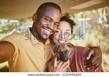 Love, dog and selfie with a couple and their adopted pet posing for a picture together in their new home. Portrait, puppy and adoption with a man, woman and foster animal taking a photograph
