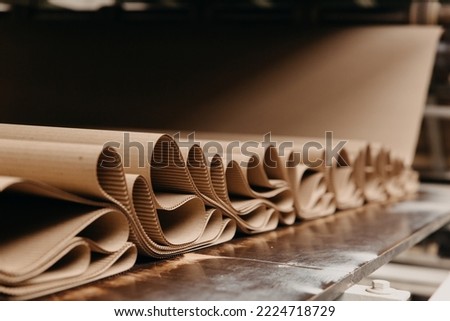 production of corrugated cardboard conveyor Royalty-Free Stock Photo #2224718729