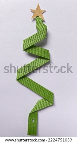 Christmas tree made from green ribbon wire tape isolated on white background. For copy space