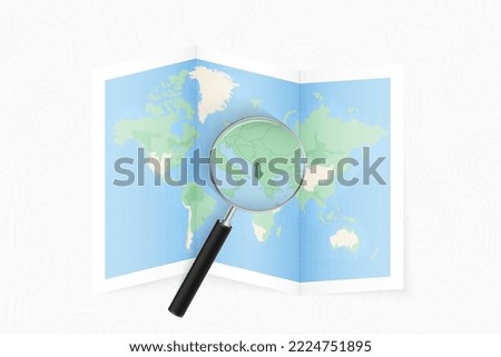 Enlarge Albania with a magnifying glass on a folded map of the world. Vector paper map.