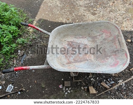 wheel barrow which is usually used to help builders carry building materials