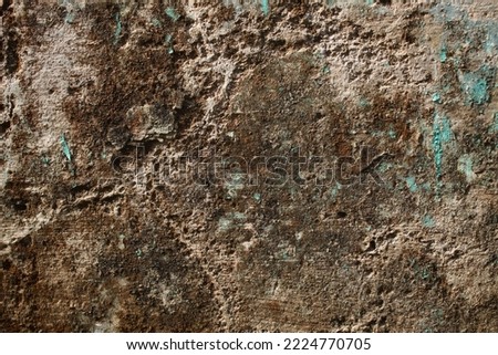 background concept using old cracked wall material, peeling wall surface forming abstract art, old wall background full of cracks and moss