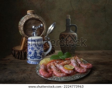 Still life with boiled shrimp and beer