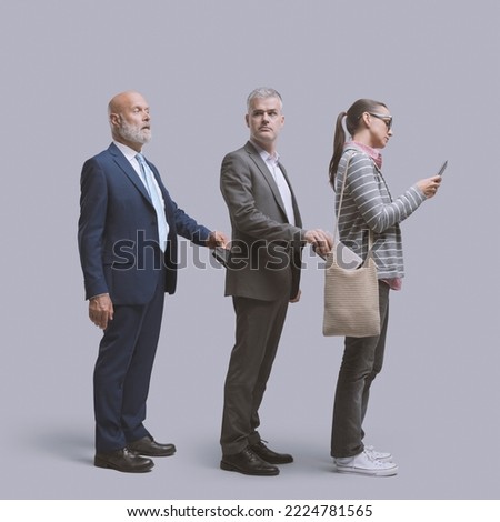Thief stealing a woman's purse and being robbed by another thief Royalty-Free Stock Photo #2224781565