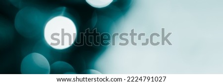 Blurred lights, dark blue background, banner texture. Abstract bokeh with soft light header. Wide screen wallpaper. Panoramic web banner with copy space for design