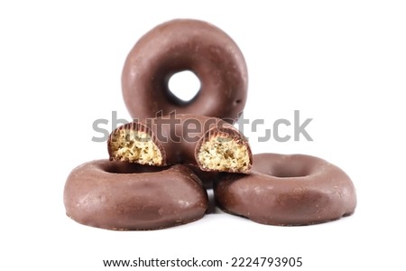 Chocolate glazed donuts on white background. Royalty-Free Stock Photo #2224793905