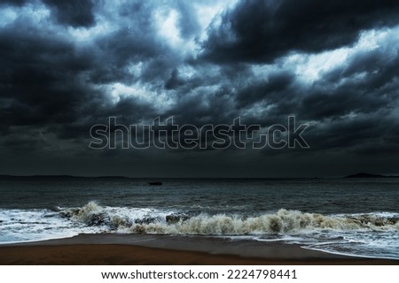 Storm seascape with dark clouds.
