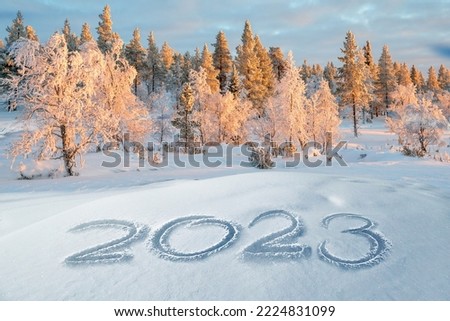 2023 written in the snow, winter landscape greeting card Royalty-Free Stock Photo #2224831099