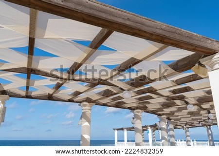 Wooden pavilion, wood pergola for sun protection on the beach