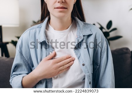 Cropped shot unhealthy sad caucasian woman having or symptomatic reflux acids, Gastroesophageal reflux disease, Because the esophageal sphincter separates the esophagus. Stomach dysfunction concept Royalty-Free Stock Photo #2224839073