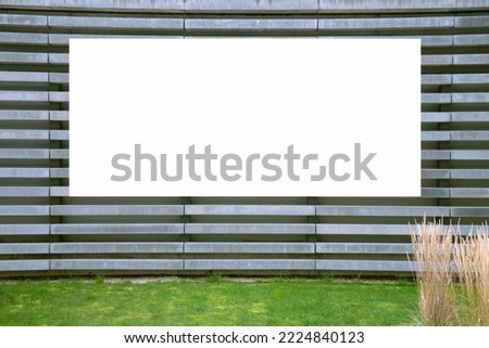 Blank white horizontal billboard sign mockup on building facade, empty space to display advertising or public information