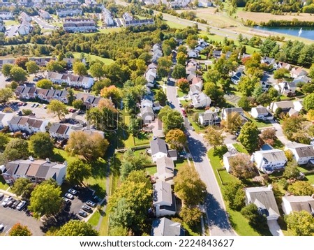 Aerial view of upscale residential area, gated community street real estate with single family homes. Autumn sunny day. Royalty-Free Stock Photo #2224843627