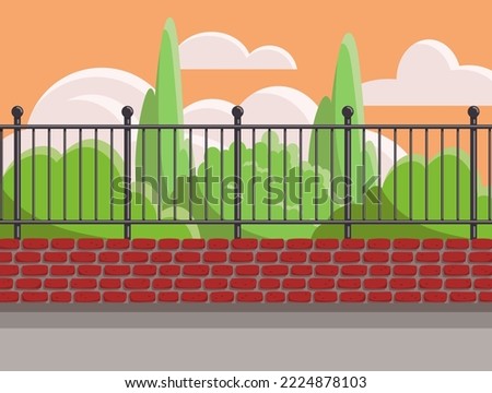 Summer park behind the fence at sunset