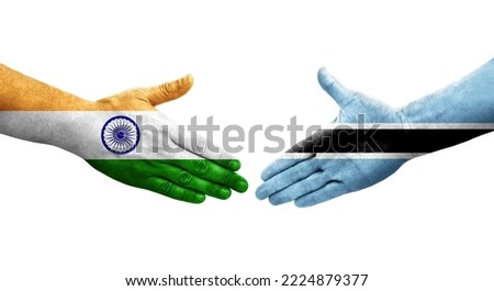 Handshake between Botswana and India flags painted on hands, isolated transparent image.