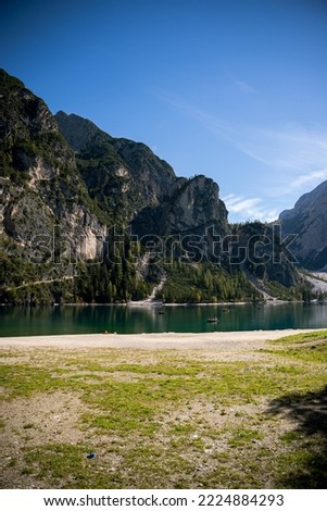 photos of Lago di Braies glacuier lake in italian dolomites