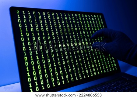 Stealing password concept. Gloved Hand, Binary code and Password word on laptop computer screen