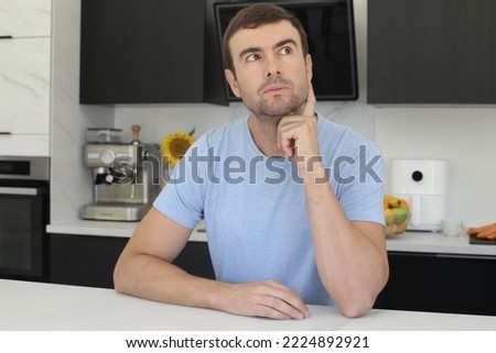 Imaginative man in the kitchen  Royalty-Free Stock Photo #2224892921