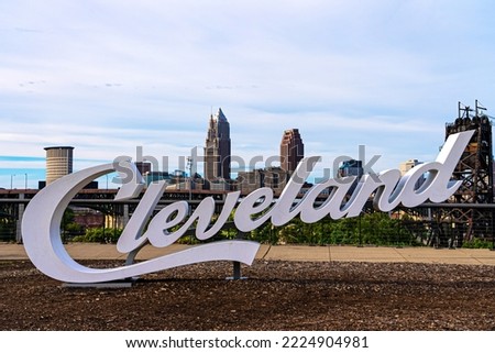 Cleveland's sign in Tremont with the city's skyline on a cloudy day in Summer.