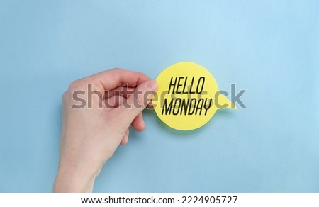 the yellow stacking of white business card with Hello Monday message on vibrant blue background , cheerful for happy working time Monday concept