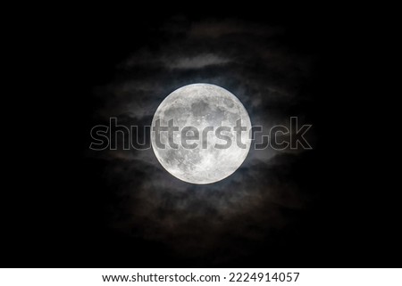 Magical full moon. Beaver Moon. Moon circle on cloudy sky.