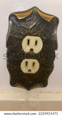 Vintage outlet cover plate found in bathroom