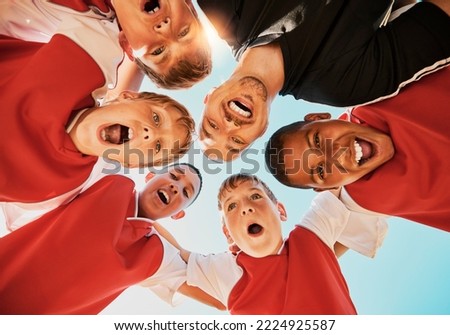 Soccer, team and coach in huddle, celebration and happy with smile, winner and boy group from bottom. Football kids, excited or children teamwork for fitness, training or workout after game or match Royalty-Free Stock Photo #2224925587